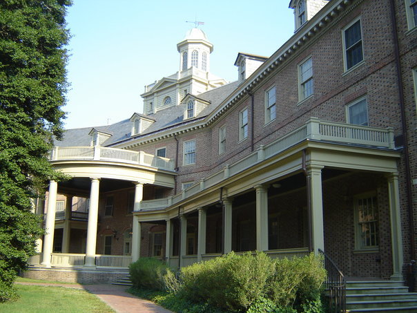 Barrett Hall from the side facing the Sunken Gardens. Located in Old Campus, the dorm is three floors with a mysterious fourth. 