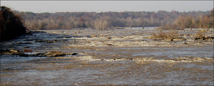 Upstream view of the James River in Richmond flowing under moderately high water conditions (~13,500 cfs, ~7' on the Richmond-Westham gage).