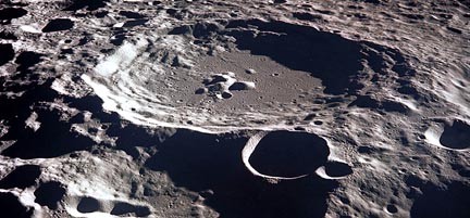 Oblique aerial view (from Apollo 11 mission) of impact craters on the Moon.