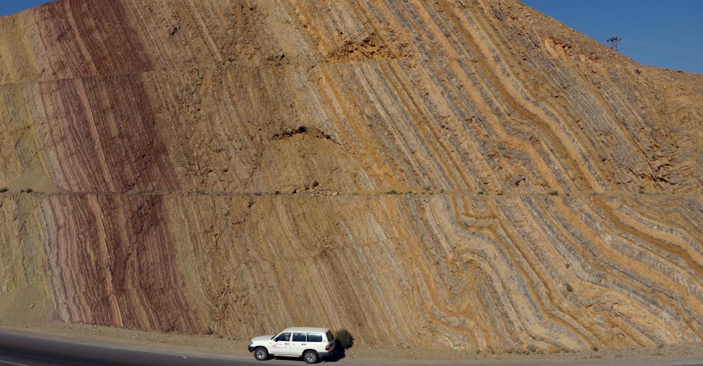 Big road cut near Nizwa, Oman exposed folded and tilted strata.