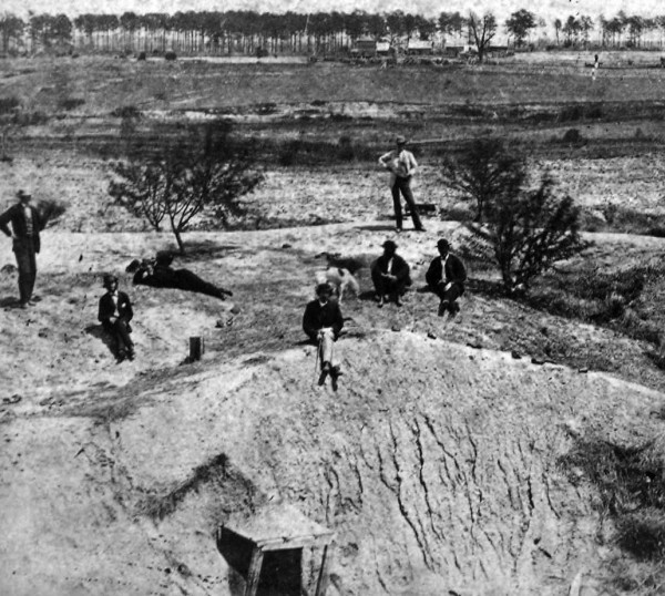 Post Civil War photo of the Crater with tourists for scale.  Note the remains of the Union tunnel and steep slopes at the site.