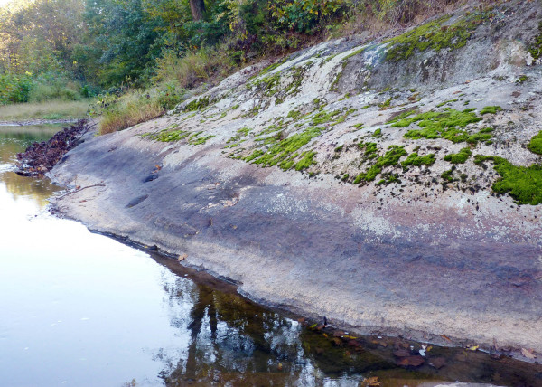 The Piney River at low water. Note the sediment and mineral coatings on the bedrock as well as moss in flights above the low flow conditions in late September.