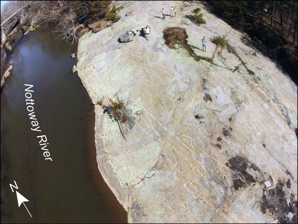 Oblique aerial view to the east-northeast of the big outcrop at the Falls of the Nottoway. Members of the William & Mary Structural Geology and Tectonics research group for scale.