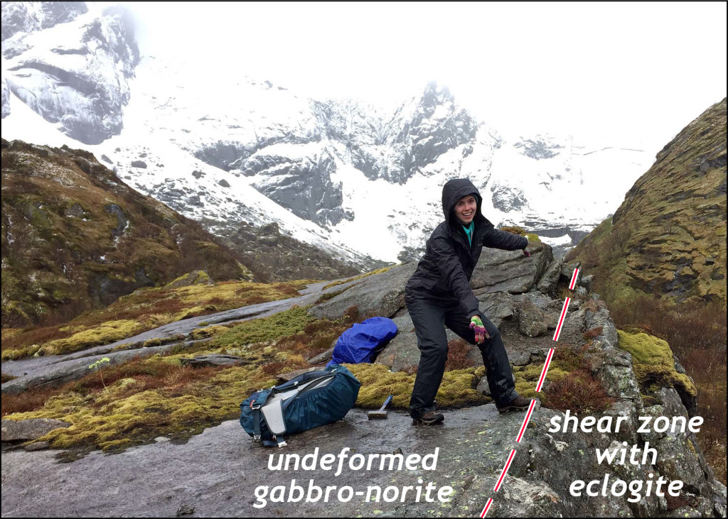 Katie Valery points out a shear zone boundary in the valley above Nusfjord.