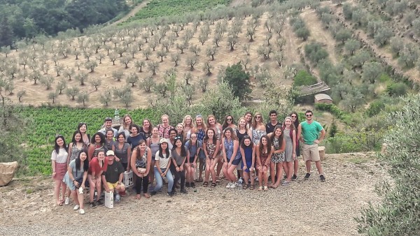 Posing for a group photo in Chianti after a wine tasting 