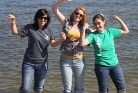 Three girls posing in the water