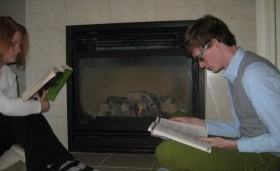 Reading Books in front of a fireplace. xCasey says all we need to be adults is books and a floor. I think the fireplace makes us classy.