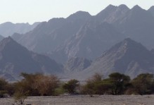 Ophiolite terrain rising above the Oman desert.