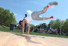 Student break dancing in Sunken Garden at Day for Admitted Students