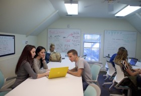 students study a laptop screen