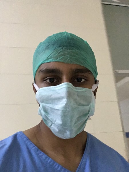 a med student in scrubs