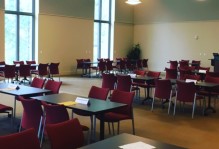 an empty room with chairs and desks