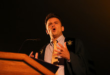 Drew Stelljes speaking at a podium