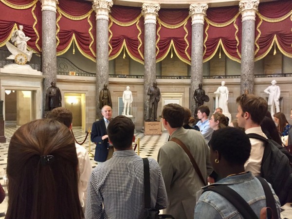 a tour group on the inside of the capital building