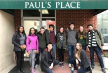 10 W&M students on a "Branch Out Alternative Breaks" trip pose in front of Paul's Place in Baltimore, MD