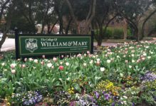 The College of William & Mary sign in a bed of flowers