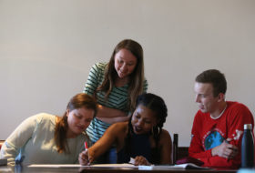 students working together on a poster