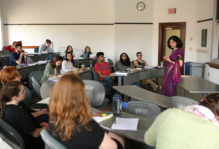 a professor lecturing a small class