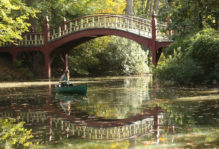 Female student in a canoe on Crim Dell in early fall