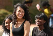 Female students at William & Mary smile for the camera at Sneak Peek - a multicultural admission event on campus each spring.