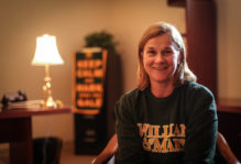 Coach Jill Ellis '88 wearing a William & Mary sweatshirt
