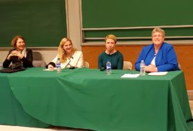 Panelists at a table, from left to right: Anne-Marie Slaughter, Sarah Glass, Anne Coleman-Honn, Sue Peterson
