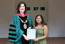 President Katherine Rowe presents Sonia Kinkhabwala ’21 with community service award