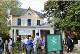 Conversational gatherings of students, faculty and others in the front lawn of the GRI yellow house.