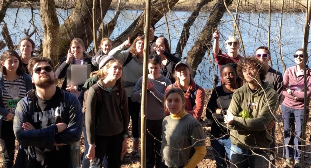 Students examining an outcrop of bedrock next to the James River.