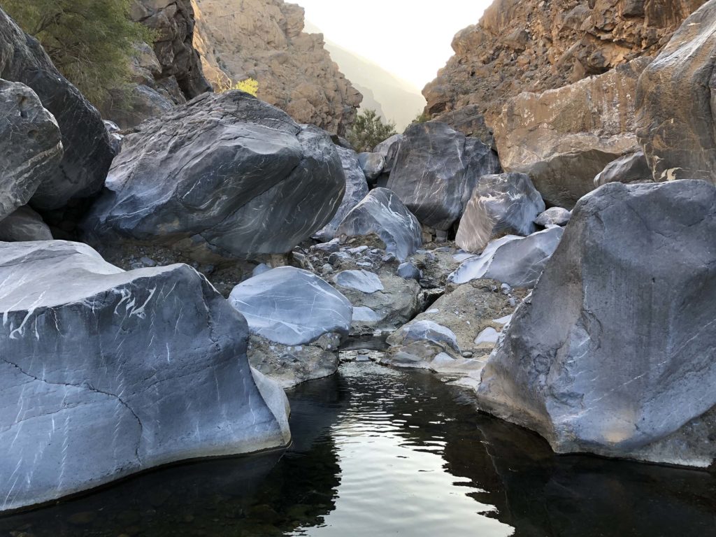 Water and rocks in the Side Gorge, Oman.