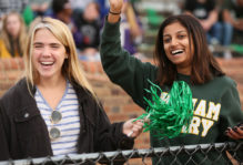 students cheering at a Tribe Football game