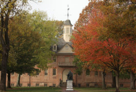 Wren Yard and Wren Building including the Lord Botetourt statue in fall with bright red foliage on one of several trees