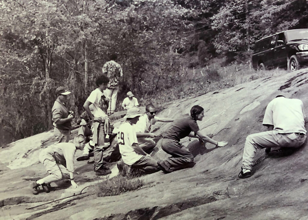 students on a bedrock outcrop.