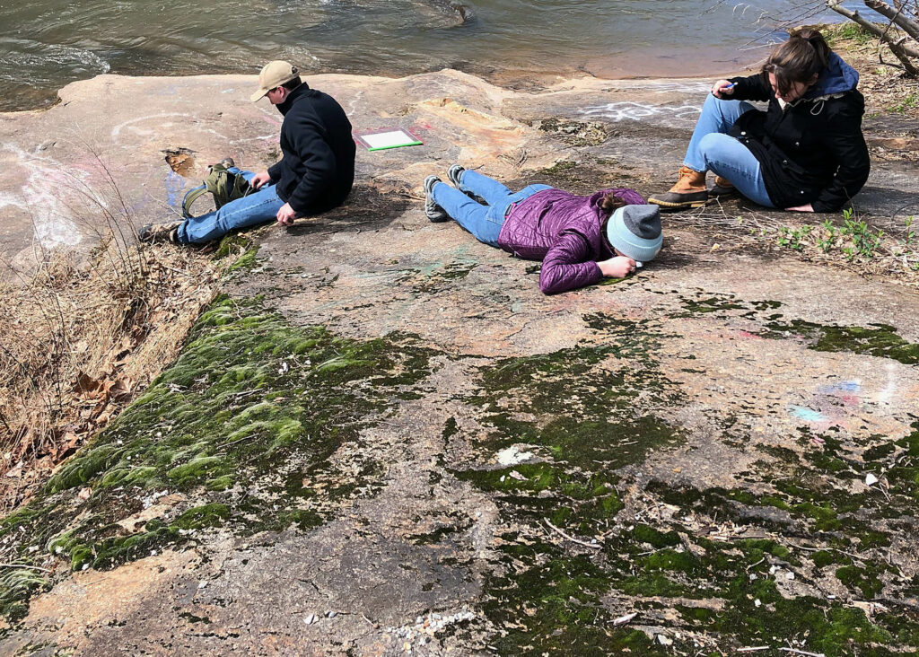 Geologists ponder an outcrop