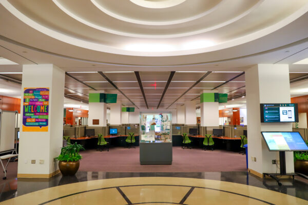Large open area of the Swem Library foyer with displays, computer stations and wayfinding screens.
