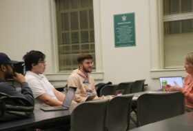 Team Global Scholars meets with mentor Catie Lott, USAID Innovation Director, in Tucker Hall to refine their proposal.