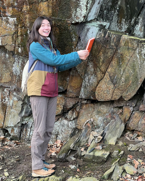 W&M geologist Annika Wolle '25 at an outcrop in New Canton, Virginia.