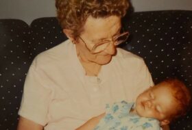 Elizabeth's grandmother holding her as a baby